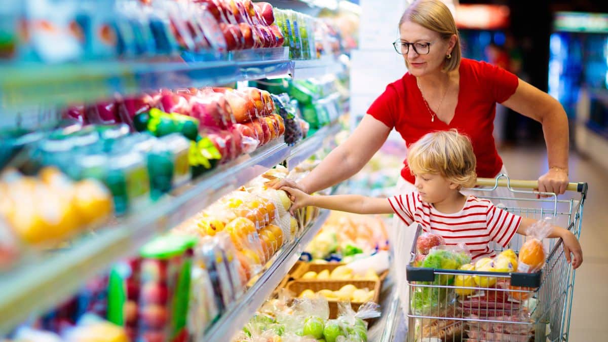 Family buying fruit at a supermarket