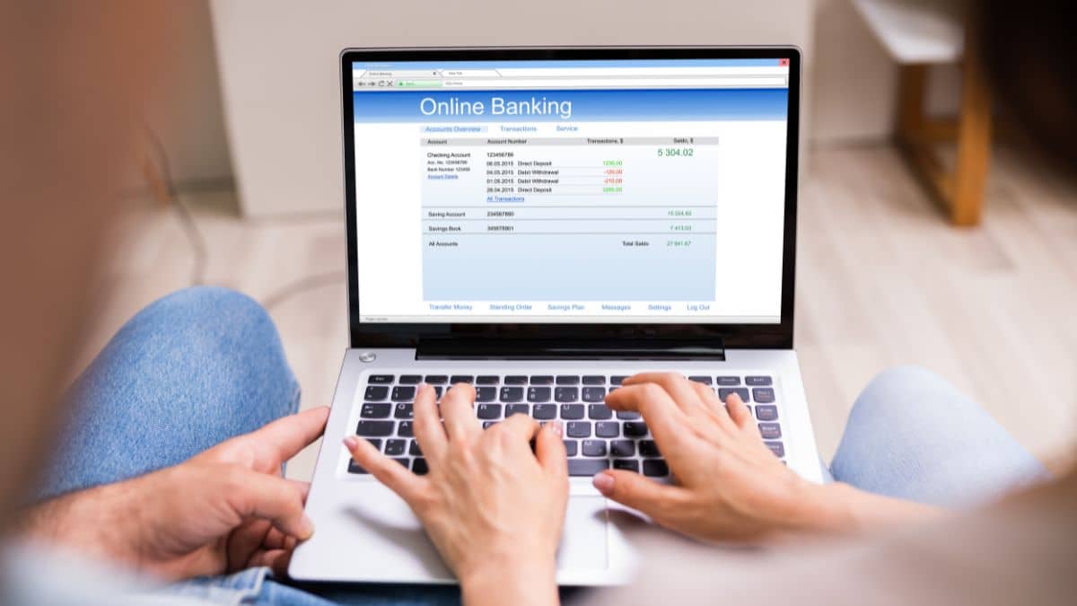 A person checking their online banking on a laptop.