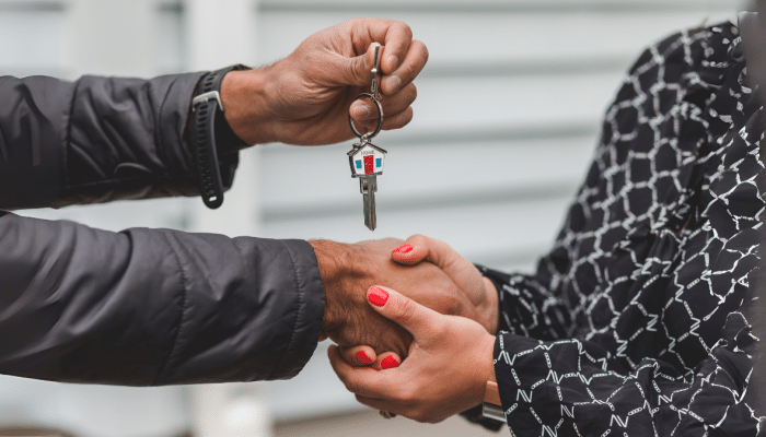 Person Holding Silver Key