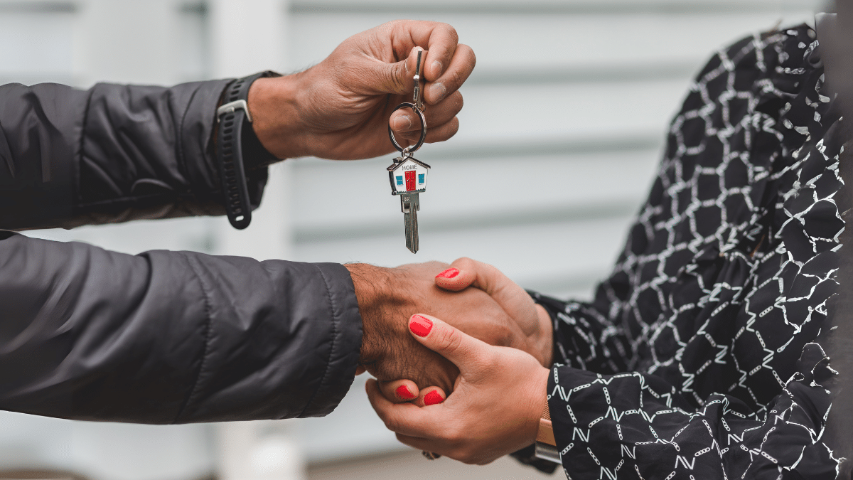 Person Holding Silver Key
