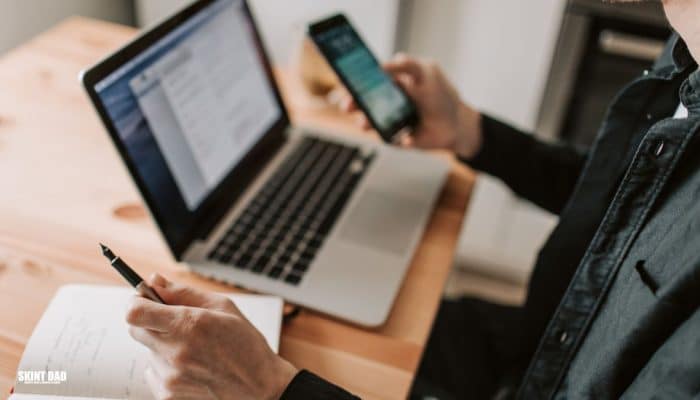 Person using a budgeting app with AI tools to manage money at home.