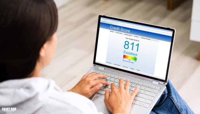 Person checking their new Experian credit score on a laptop