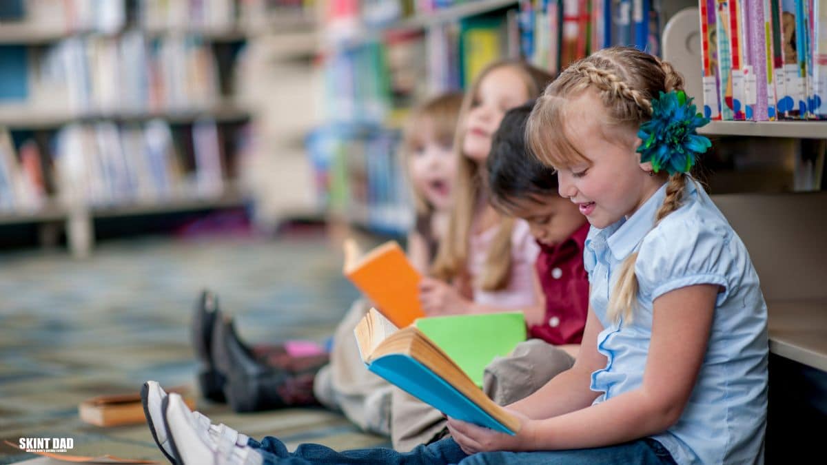 Children reading in a public library that offers free community space and support for families on tight budgets.