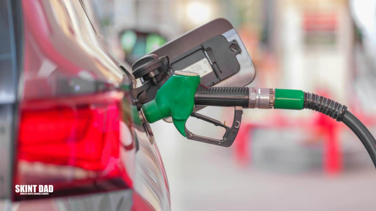 fuel pump filling a red car