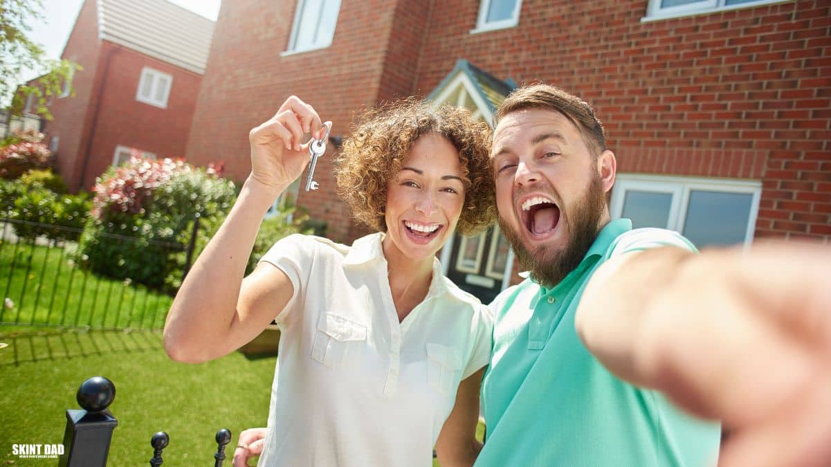 Illustration of a couple holding house keys outside a home