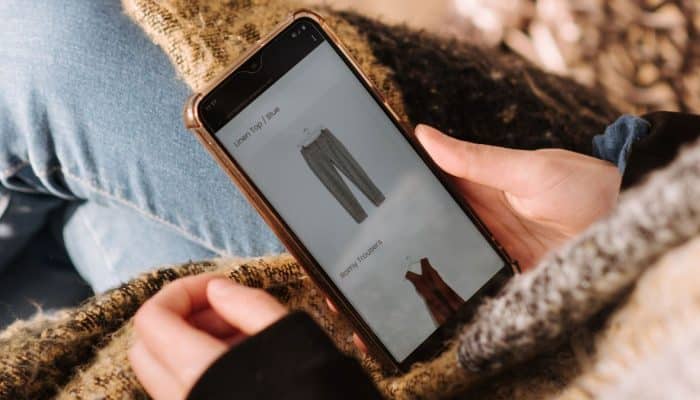 Woman browsing clothes on a smartphone