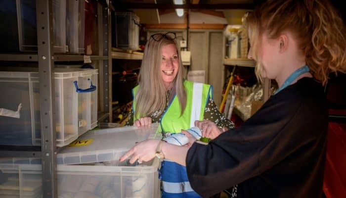 Two women working together in a warehouse