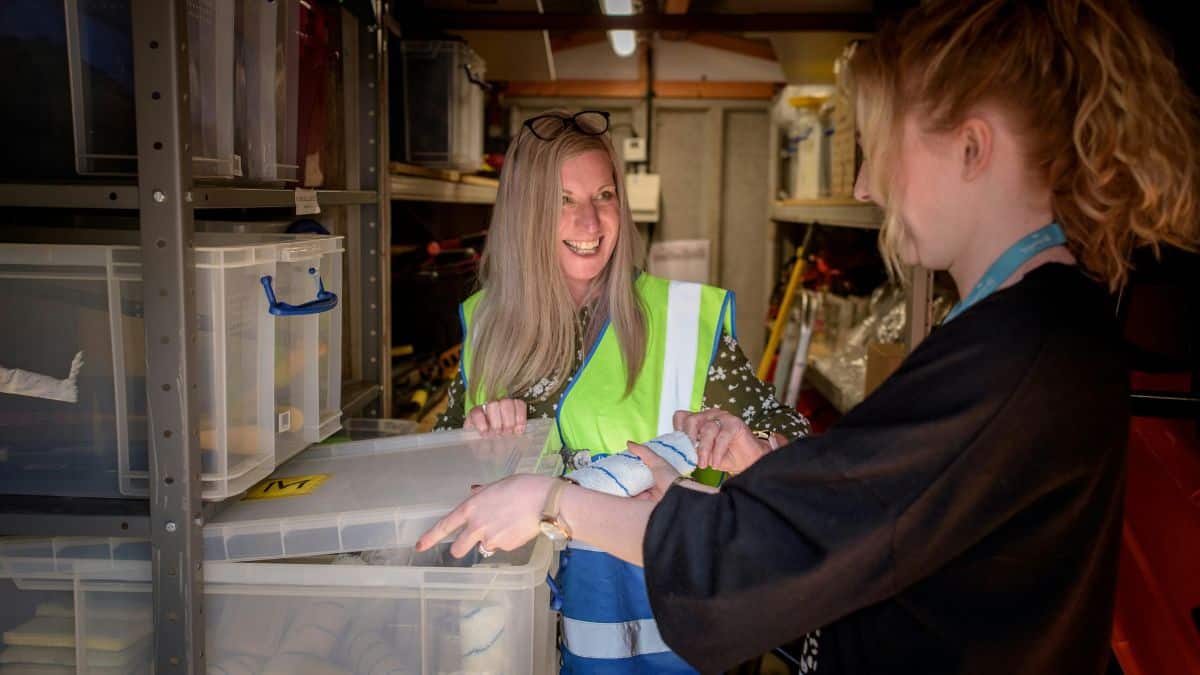 Two women working together in a warehouse