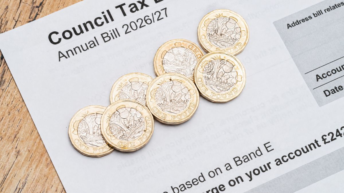 Close-up of a Council Tax bill with British pound coins