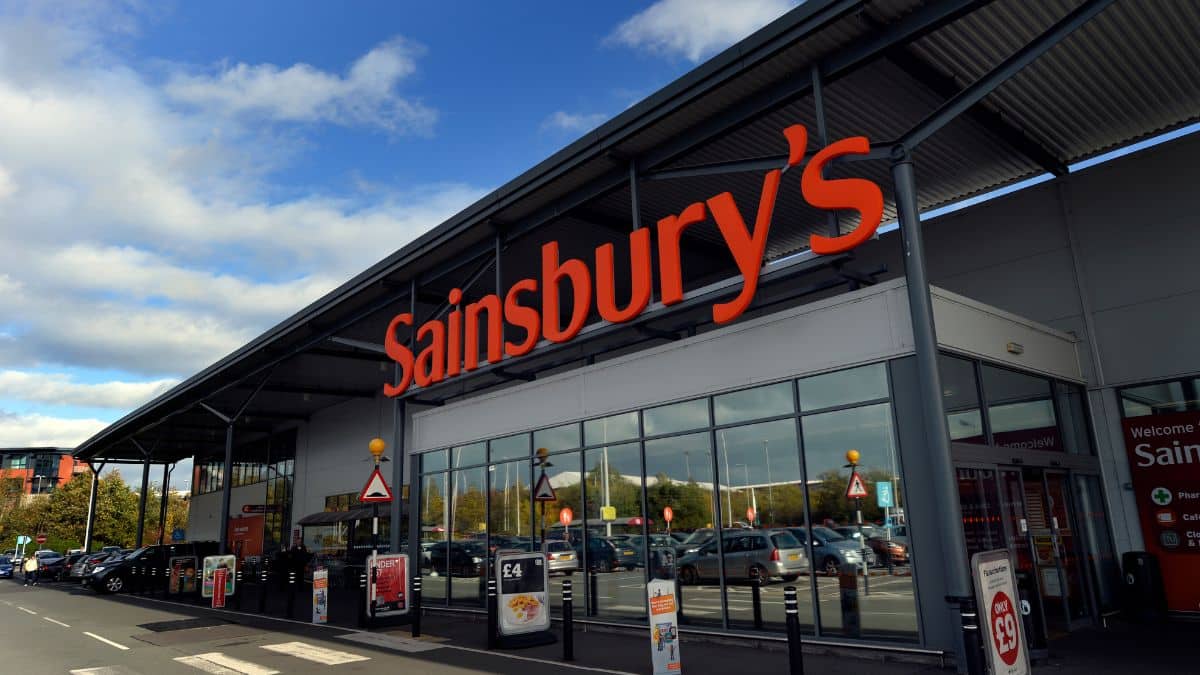 Exterior of a Sainsbury's supermarket with its orange sign above the entrance