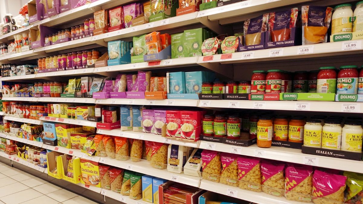 A supermarket aisle in London stocked with biscuits, cereal bars and other packaged food